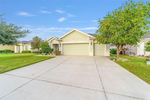 ranch-style house featuring a garage and a front lawn