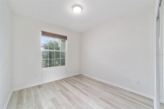 unfurnished room with light hardwood / wood-style flooring