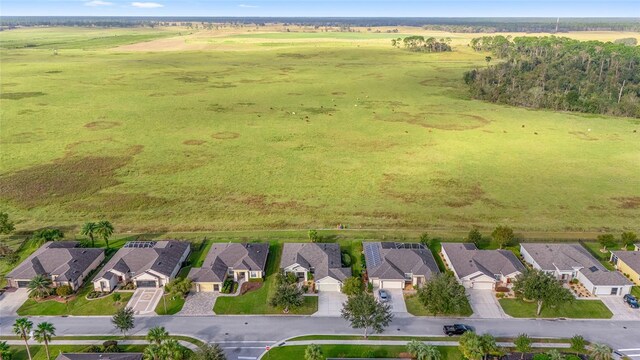 birds eye view of property with a rural view