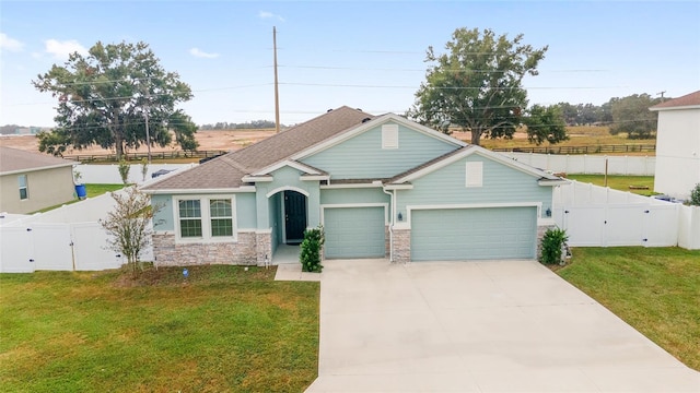 view of front of house with a garage and a front lawn