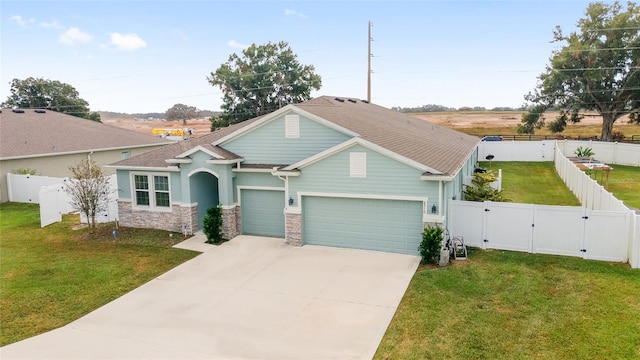 view of front of house with a garage and a front yard