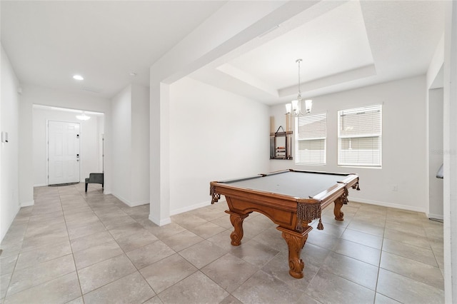 playroom featuring light tile patterned flooring, a tray ceiling, an inviting chandelier, and billiards