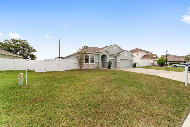 view of front of property with a garage and a front lawn