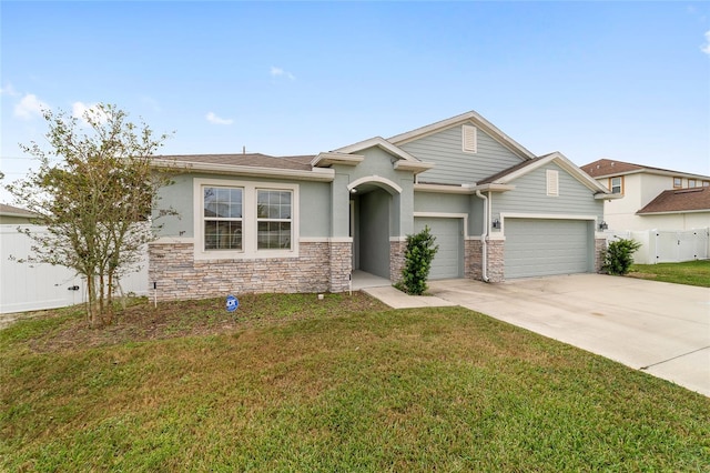 view of front of house with a garage and a front yard