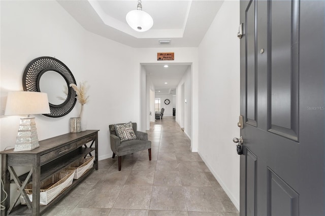 foyer featuring a tray ceiling