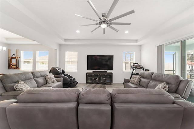 living room with ceiling fan, a healthy amount of sunlight, and wood-type flooring