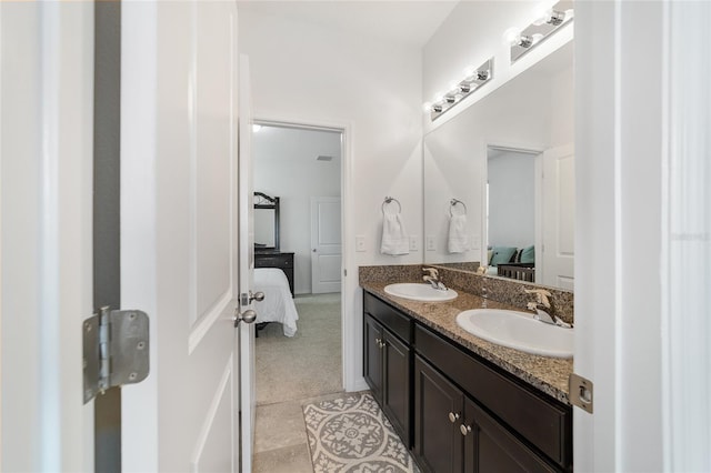 bathroom with tile patterned flooring and vanity