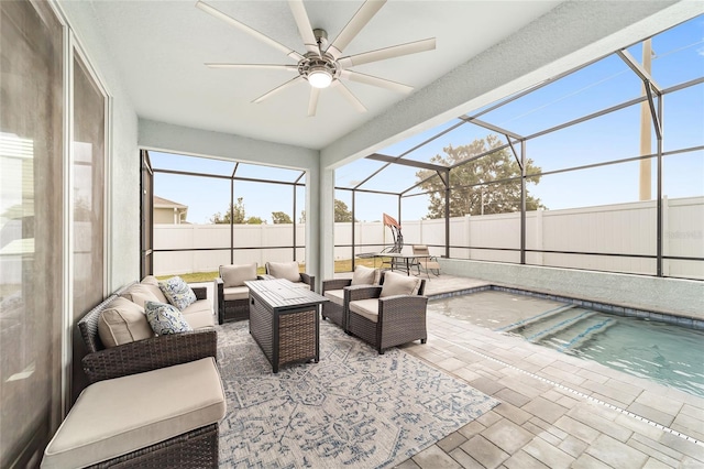 sunroom / solarium featuring ceiling fan and a pool