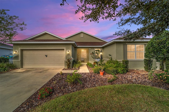 ranch-style house featuring a garage