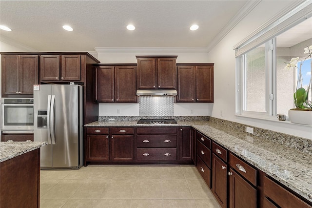 kitchen with ornamental molding, light stone counters, and stainless steel appliances