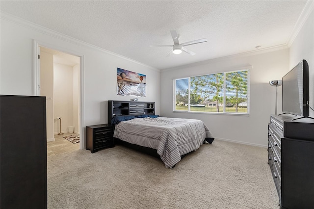 carpeted bedroom featuring ceiling fan, a textured ceiling, and ornamental molding