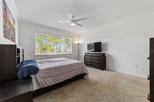 carpeted bedroom featuring ornamental molding, a textured ceiling, and ceiling fan