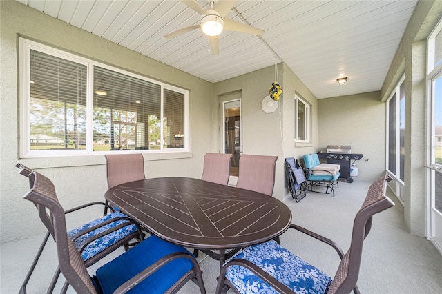 sunroom / solarium featuring ceiling fan