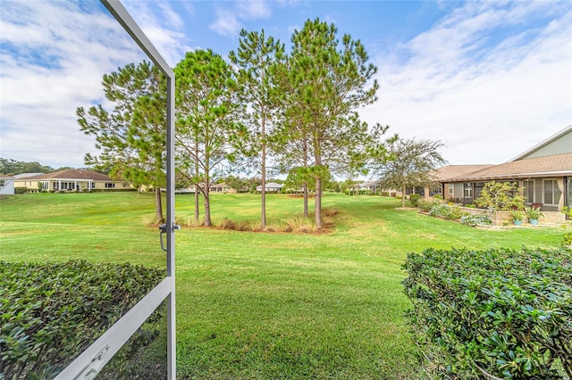 view of yard featuring a sunroom