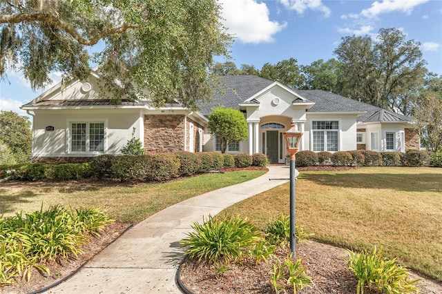 view of front of property with a front lawn