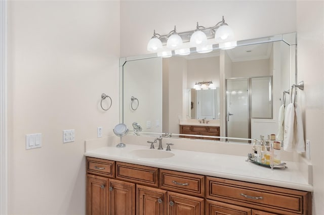 bathroom with a shower with door and vanity