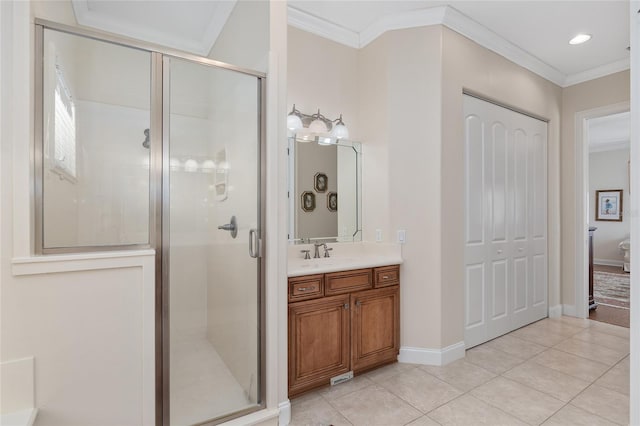 bathroom featuring ornamental molding, vanity, tile patterned floors, and a shower with door