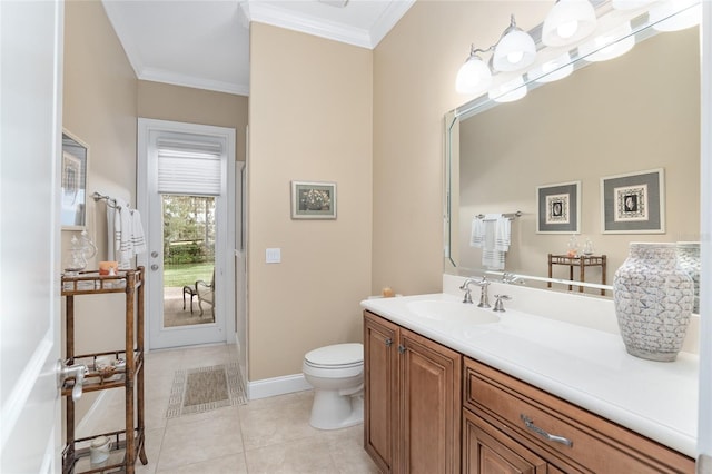 bathroom featuring ornamental molding, toilet, vanity, and tile patterned floors