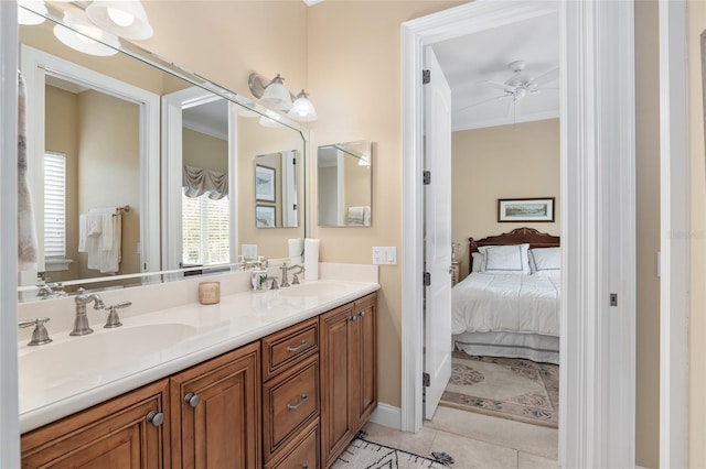 bathroom featuring ornamental molding, tile patterned flooring, vanity, and ceiling fan