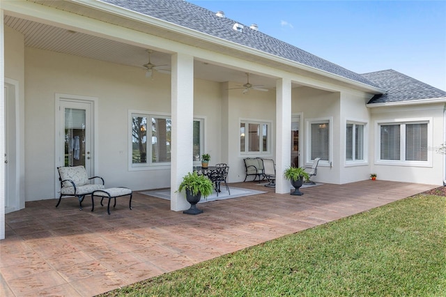 rear view of house with a lawn, ceiling fan, and a patio area