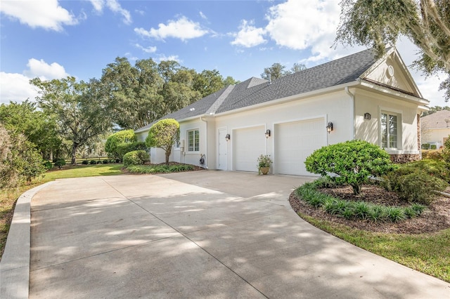 view of side of property with a garage