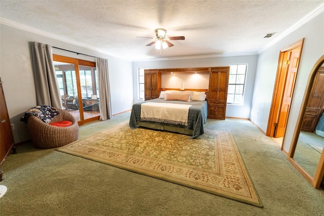 bedroom featuring access to outside, a textured ceiling, and ceiling fan