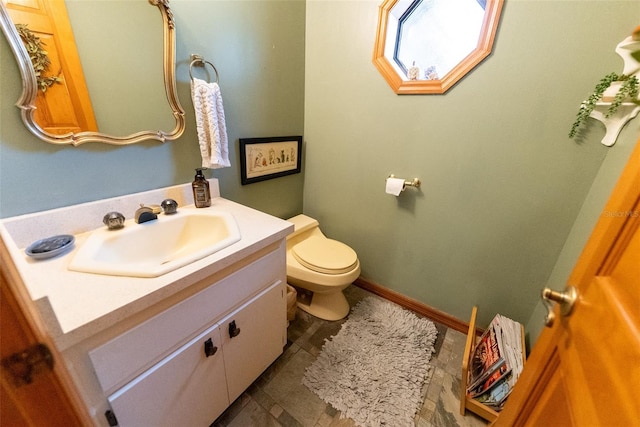 bathroom with toilet and vanity