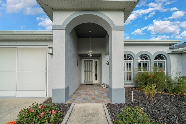 doorway to property featuring a garage