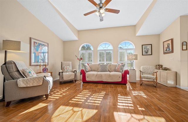 living room with hardwood / wood-style floors and ceiling fan