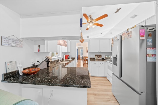 kitchen with light hardwood / wood-style floors, dark stone counters, white cabinets, kitchen peninsula, and stainless steel fridge with ice dispenser