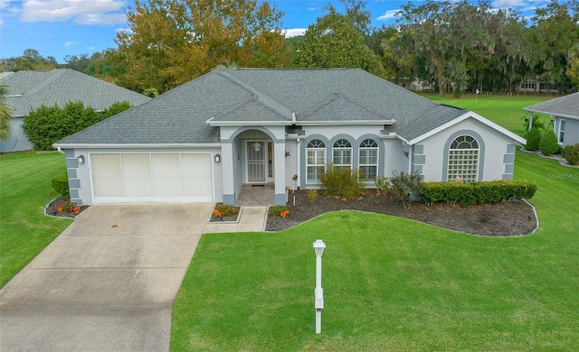 ranch-style house featuring a garage and a front lawn