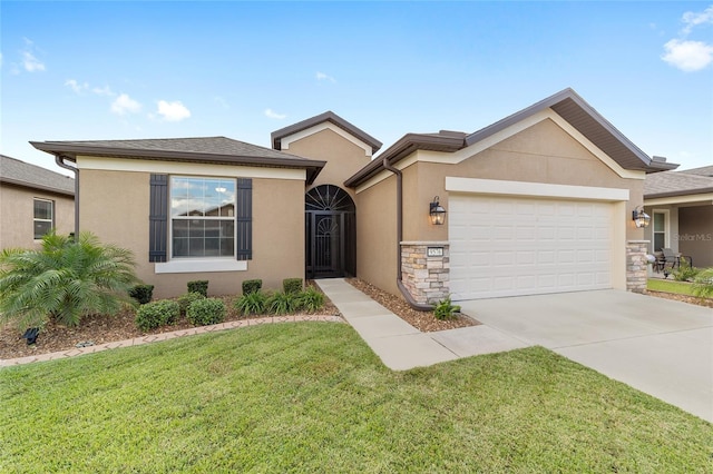 view of front of home with a garage and a front lawn