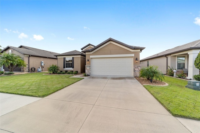 single story home featuring a garage and a front lawn