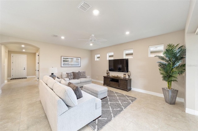 living room with ceiling fan and light tile patterned floors