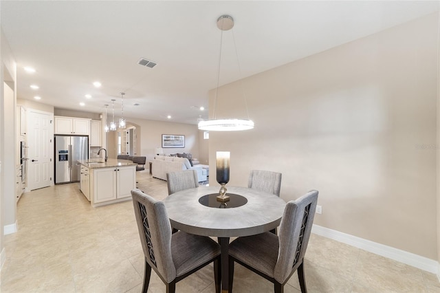 dining space with sink