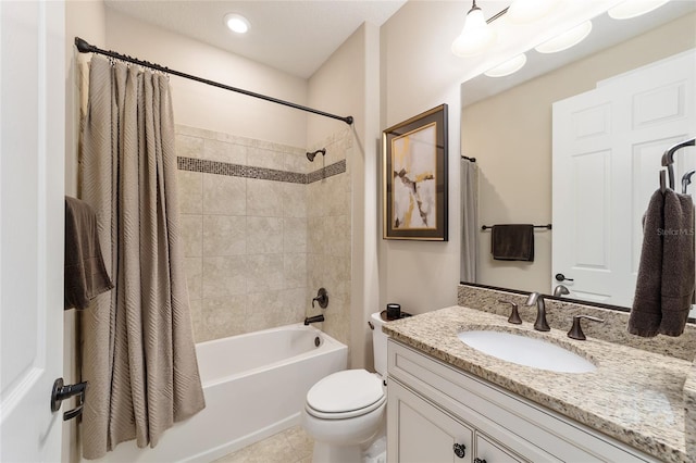 full bathroom featuring tile patterned flooring, vanity, shower / bath combination with curtain, and toilet