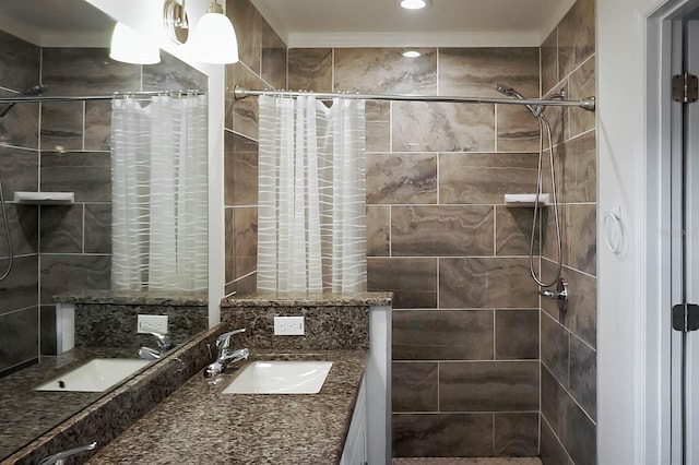 bathroom with curtained shower and vanity