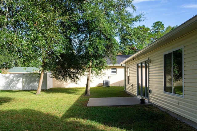 view of yard with central AC unit