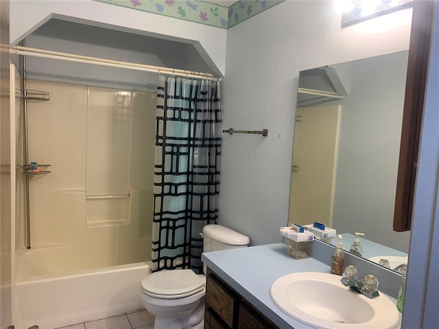 full bathroom featuring tile patterned floors, shower / bath combo with shower curtain, vanity, and toilet