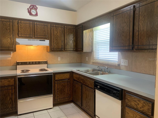 kitchen with dark brown cabinetry, sink, backsplash, white appliances, and light tile patterned floors