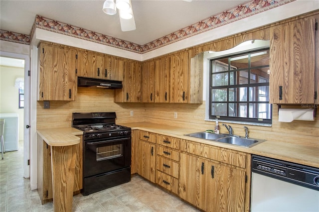 kitchen featuring a wealth of natural light, black range with gas cooktop, sink, dishwasher, and range hood