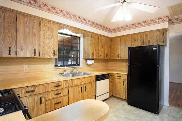 kitchen featuring backsplash, ceiling fan, sink, and black appliances