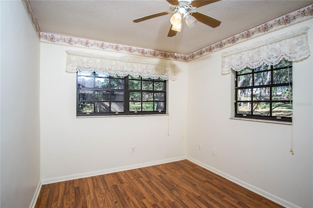 unfurnished room with ceiling fan, wood-type flooring, and a textured ceiling