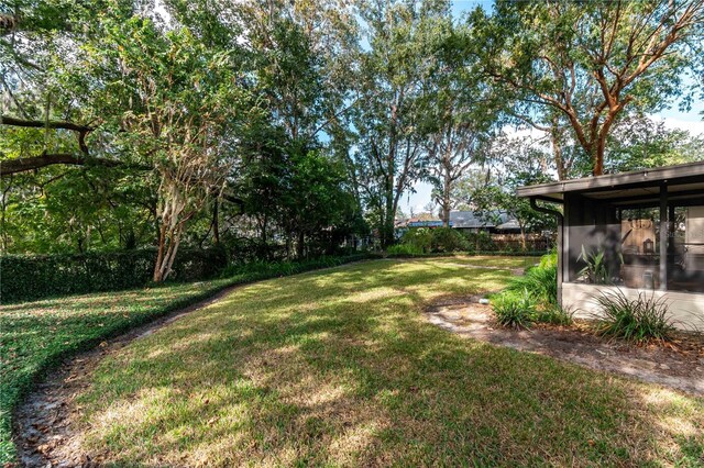 view of yard featuring a sunroom