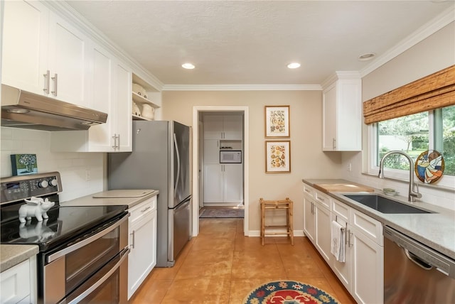 kitchen with decorative backsplash, stainless steel appliances, sink, light tile patterned floors, and white cabinetry