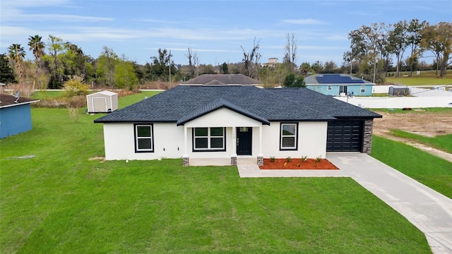 view of front facade with driveway, a garage, a front lawn, and roof with shingles