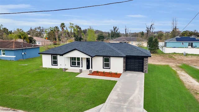 view of front of home with an attached garage, driveway, a front lawn, and a shingled roof