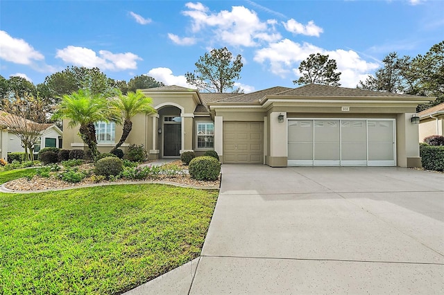 view of front facade featuring a garage and a front yard