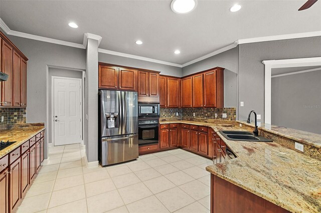 kitchen featuring sink, black appliances, ornamental molding, light stone countertops, and decorative backsplash