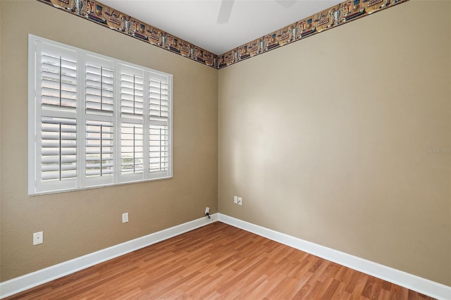 spare room with hardwood / wood-style flooring